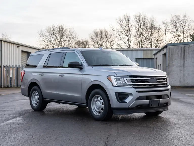 Full-size SUV in fleet specification on a depot apron
