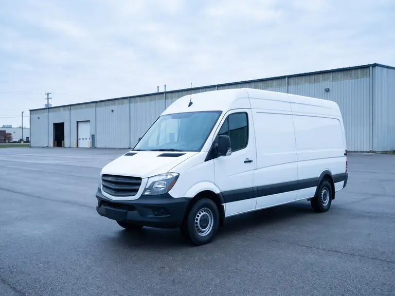 High-roof panel cargo van in fleet specification on a depot apron